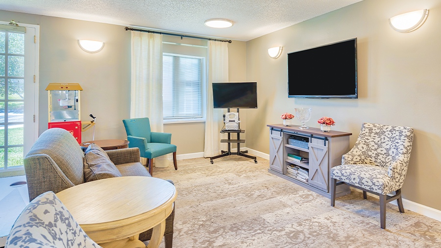 Media room with popcorn and seating at American House Hendersonville Assisted Living and Memory Care Facility