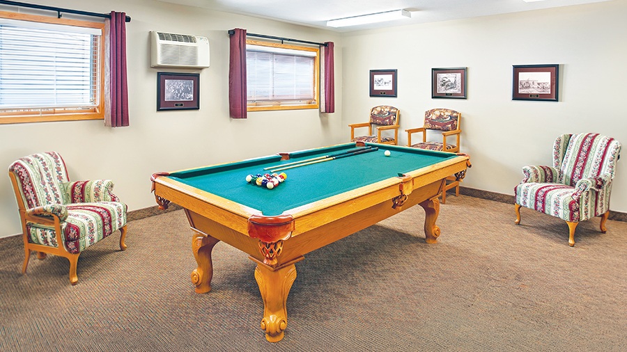 Activity room with billiards table at American House Holland, a retirement community with independent, assisted living and memory care in Holland, MI