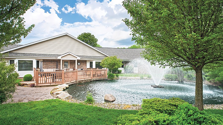 Outdoor patio and fountain at American House Holland, a retirement community with independent, assisted living and memory care in Holland, MI
