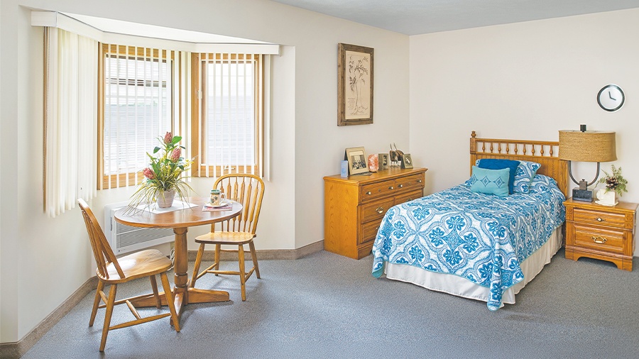 Model bedroom at American House Holland, a retirement community with independent, assisted living and memory care in Holland, MI