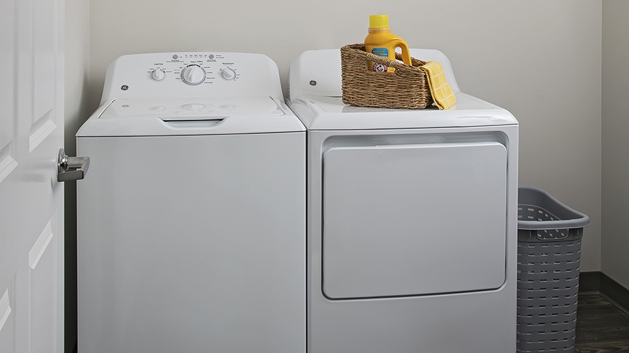 Washer and dryer in an apartment at American House East I Villas independent senior living in Roseville, MI