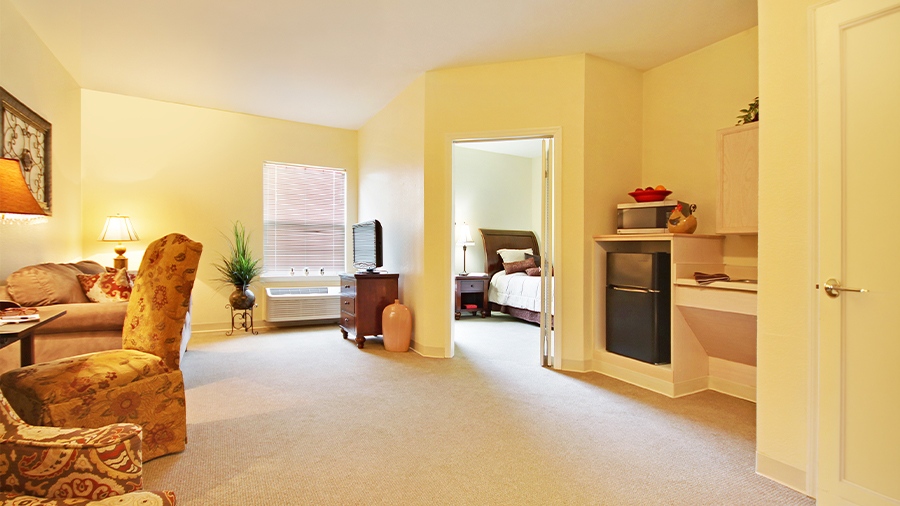 Model showing living room, kitchenette and bedroom at American House Brentwood, a senior living community in Nashville, Tennessee