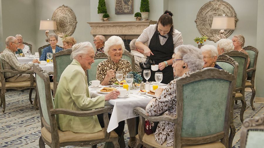 Dining room and brunch being served at American Bluewater Bay, a senior living community in Niceville, FL
