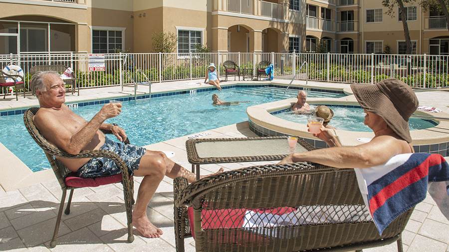 Outdoor pool and hot tub at American Bluewater Bay, a senior living community in Niceville, FL