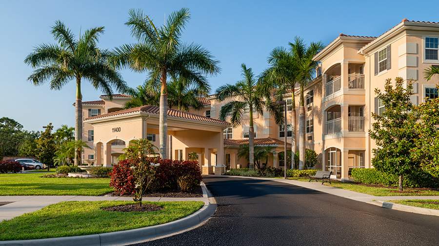 Front entrance and driveway at American House Bonita Springs assisted living and memory care facility