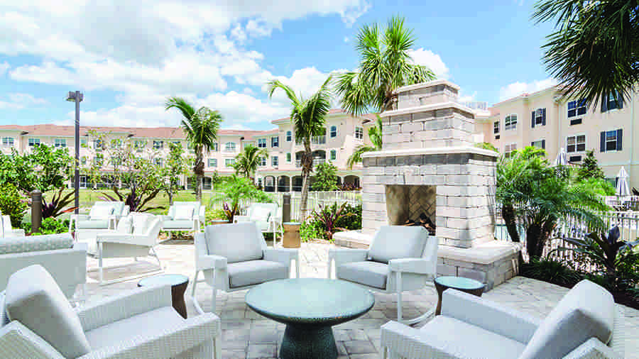 Outdoor fireplace at American House Bonita Springs Independent Living luxury retirement community