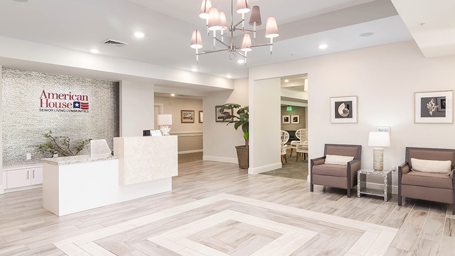 Reception desk and lobby at American House Bonita Springs Independent Living luxury retirement community