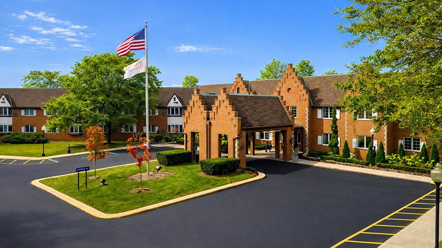 Front entrance at American House East I independent living and assisted living facility in Roseville, MI