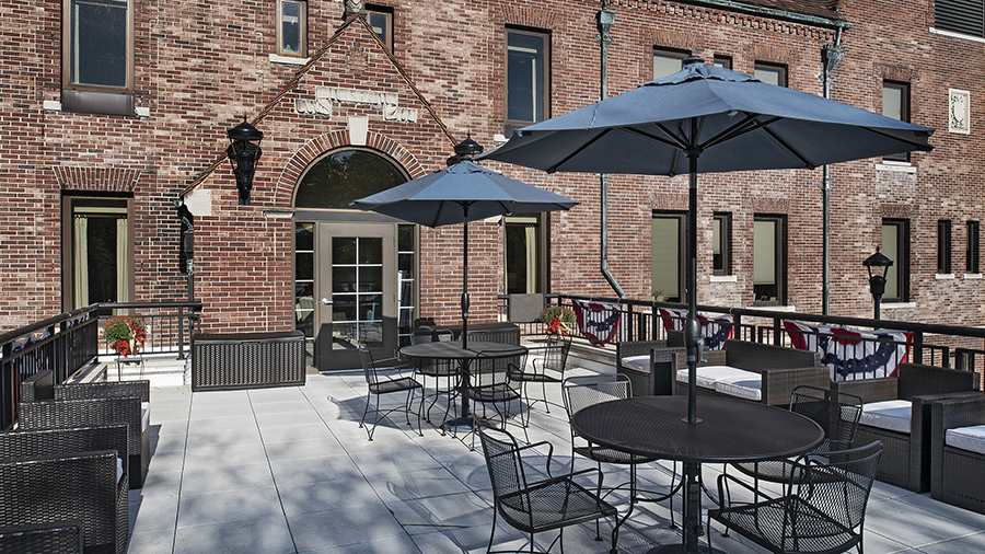 Patio seating at American House Grosse Pointe Cottage Senior Living Facility