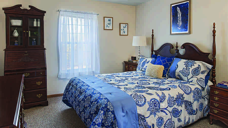 Model bedroom at American House Riverview Senior Living Facility