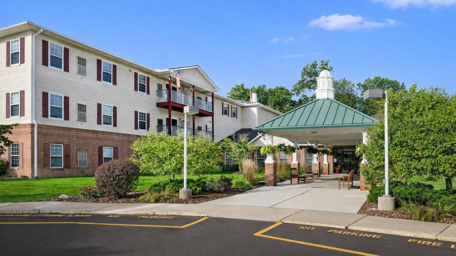 Exterior front entrance of American House Riverview Senior Living Facility