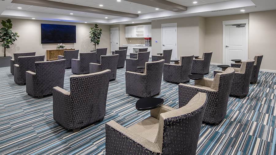 Movie theater at American House St. Petersburg Independent Living, Assisted Living, and Memory Care senior living facility in St. Petersburg, FL