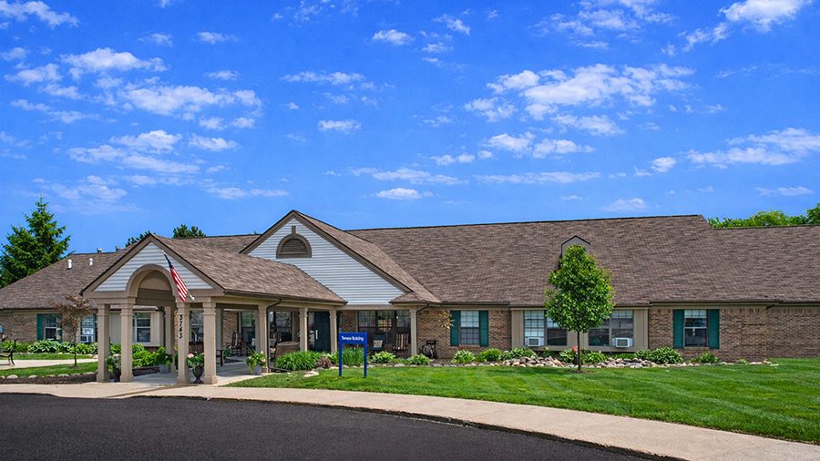 Front driveway and entrance at American House Village of Rochester Senior Living Community in Rochester Hills, MI