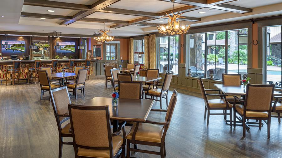 Saloon with bar at American House Wildwood, an assisted living facility in Wildwood, FL