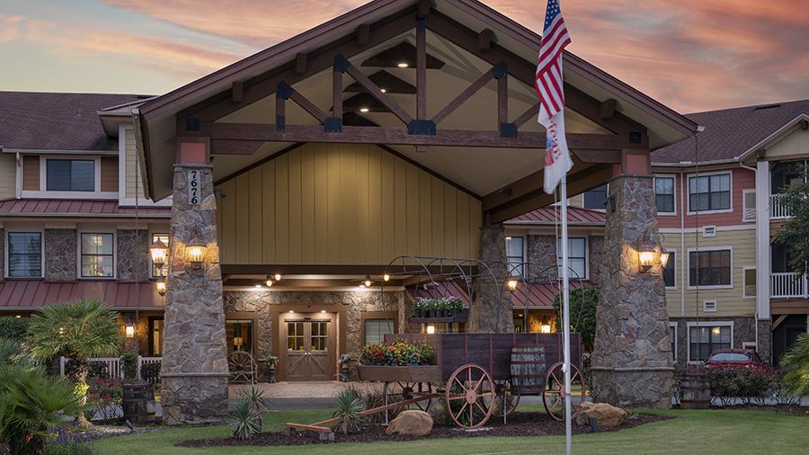 Front entrance at sunset at American House Wildwood, an assisted living facility in Wildwood, FL