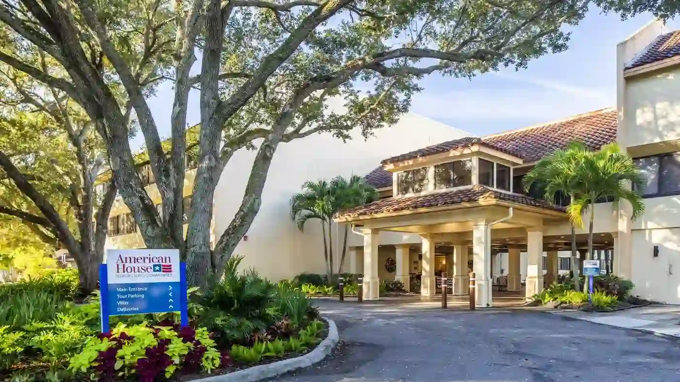 Front Driveway with Palm Trees at American House Sarasota Senior Living Community