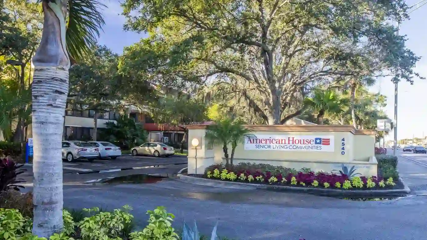 Exterior of Parking Lot and Sign at American House Sarasota Senior Living Community