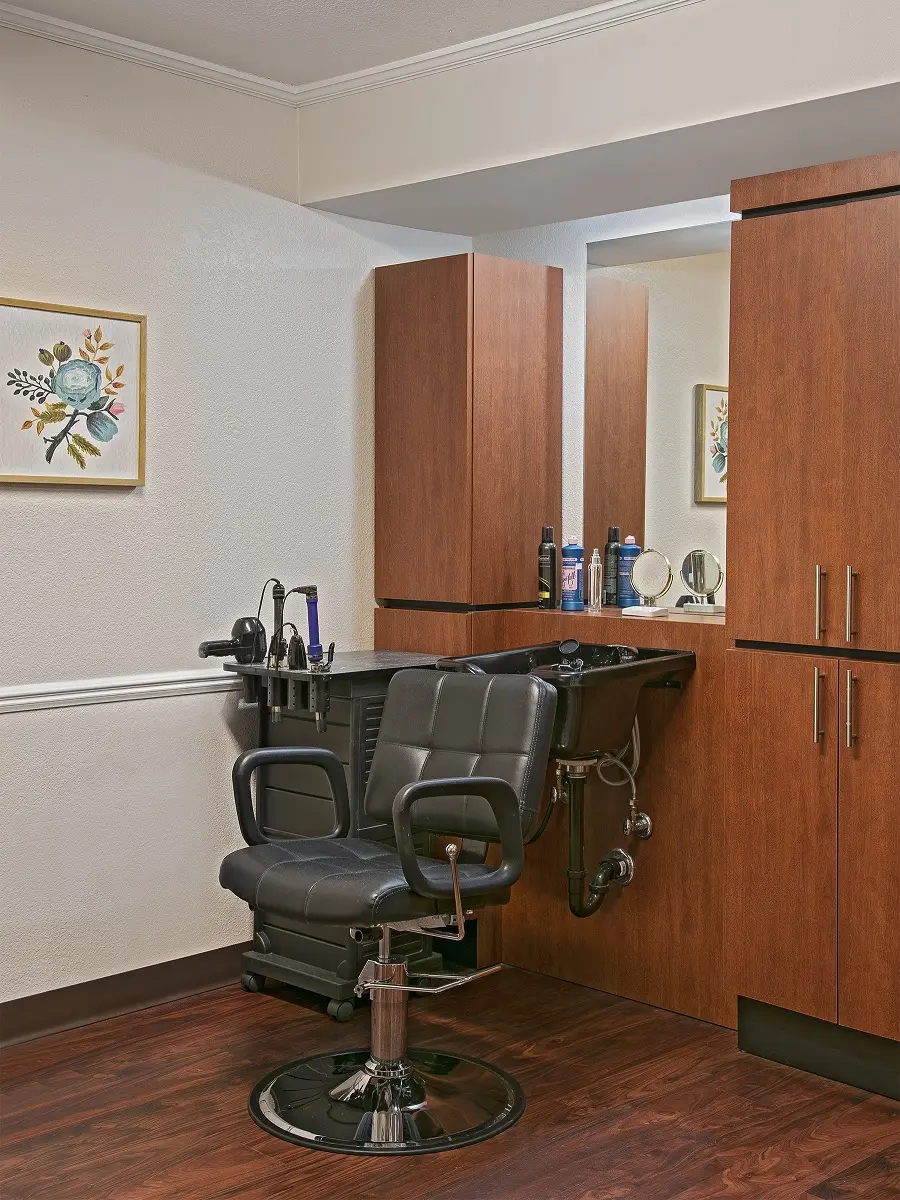 Empty barber chair at a salon/barbershop in a senior living community in Westland, MI